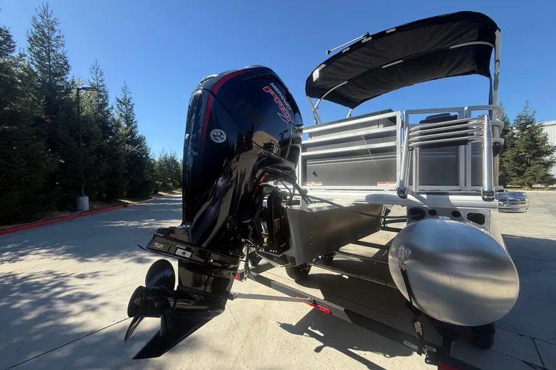 Slide: The Image of 2027 Sun Tracker SportFish 20 DLX pontoon boat with powerful outboard motor. - 18