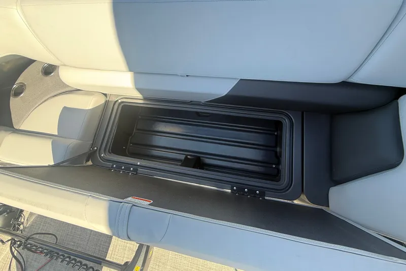 Slide: The Image of 2027 Sun Tracker SportFish 20 DLX boat seat storage compartment, open and empty. - 45