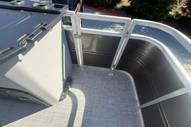 Slide: The Image of 2027 Sun Tracker SportFish 20 DLX boat interior with sleek railing and textured flooring. - 29