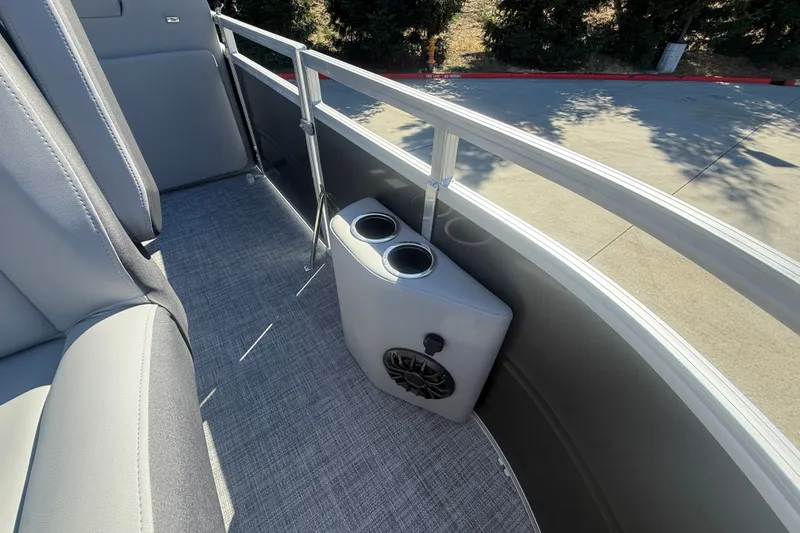 Slide: The Image of Interior of 2027 Sun Tracker SportFish 20 DLX boat with cup holders and speaker. - 49