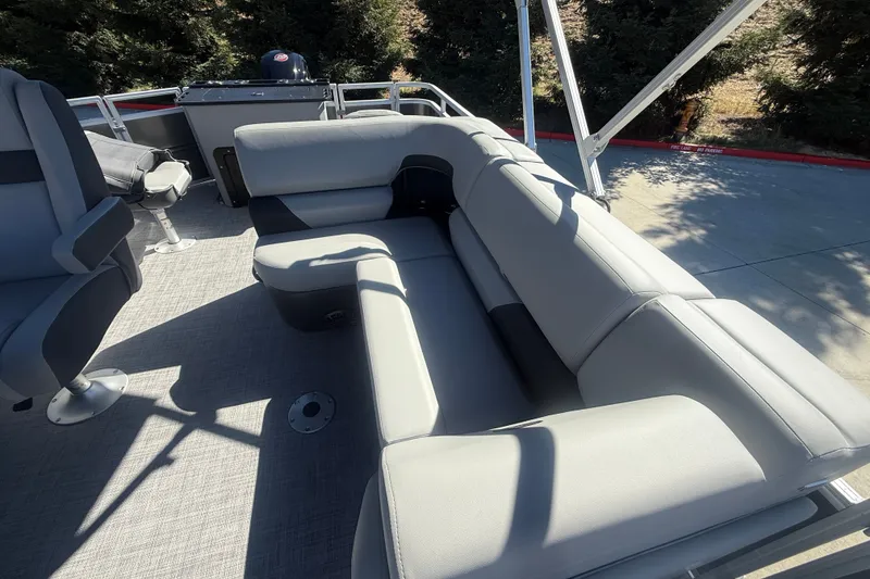 Slide: The Image of 2027 Sun Tracker SportFish 20 DLX pontoon boat with gray seating and spacious deck. - 42