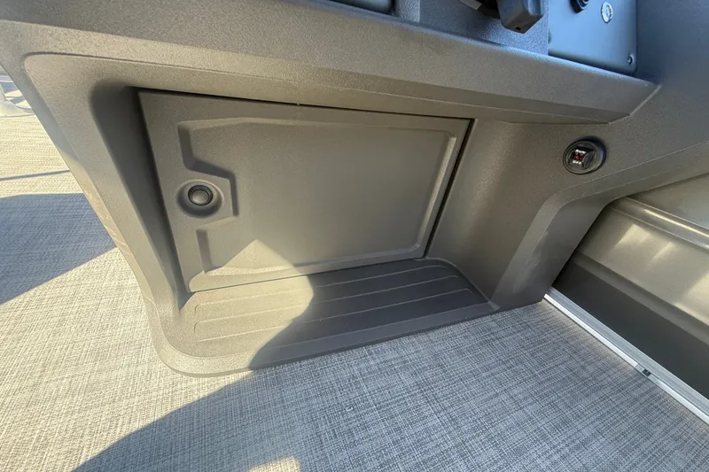 Slide: The Image of 2027 Sun Tracker SportFish 20 DLX boat interior storage compartment with textured flooring. - 35