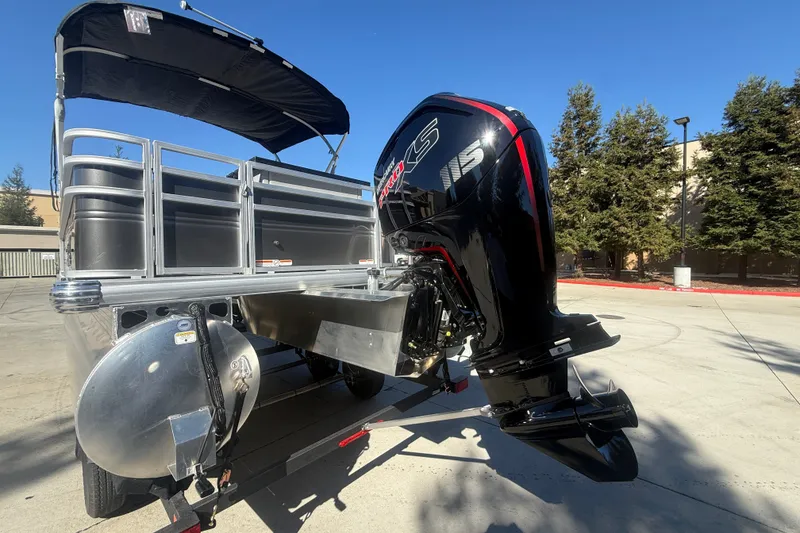 Slide: The Image of 2027 Sun Tracker SportFish 20 DLX pontoon boat with powerful outboard motor. - 15