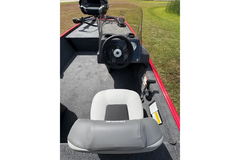 Slide: The Image of Interior view of 2027 Tracker Bass Tracker Classic XL boat, featuring steering wheel and seating. - 15