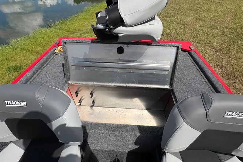 Slide: The Image of 2027 Tracker Bass Tracker Classic XL boat interior with seating and storage compartment. - 14