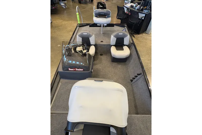 Slide: The Image of 2027 Tracker Bass Tracker Classic XL boat interior with seating and console. - 65