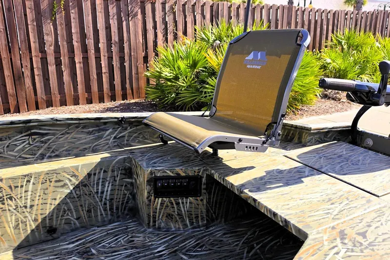 Slide: The Image of 2027 Tracker Grizzly 1650 T Prairie Wings Edition boat with camo design and seating. - 16