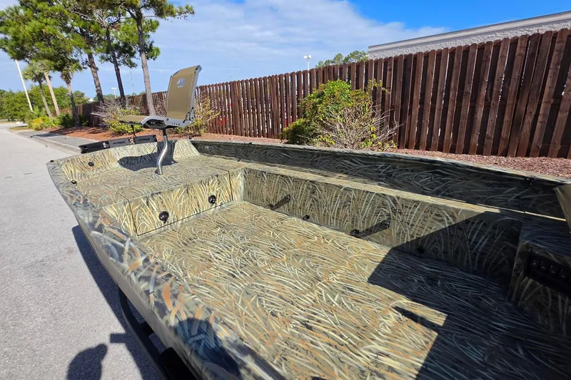 Slide: The Image of 2027 Tracker Grizzly 1650 T Prairie Wings Edition boat with camouflage design. - 17