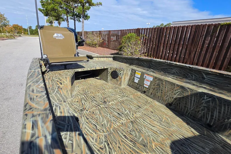 Slide: The Image of 2027 Tracker Grizzly 1650 T Prairie Wings Edition boat with camouflage interior design. - 14