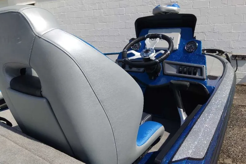 Slide: The Image of 2027 Nitro Z18 XL Pro boat interior with steering wheel and dashboard controls. - 5