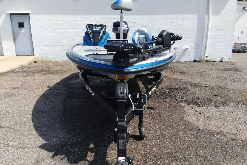 Slide: The Image of 2027 Nitro Z18 XL Pro boat with Garmin equipment on a trailer in a parking lot. - 8
