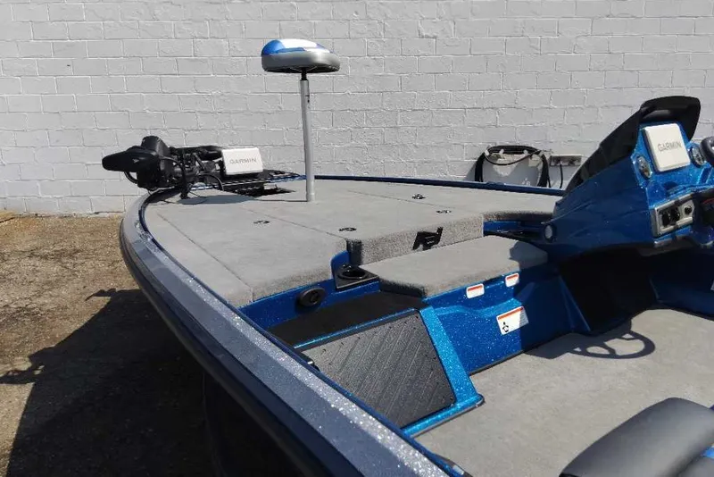 Slide: The Image of 2027 Nitro Z18 XL Pro boat with Garmin electronics, blue finish, and spacious deck. - 2