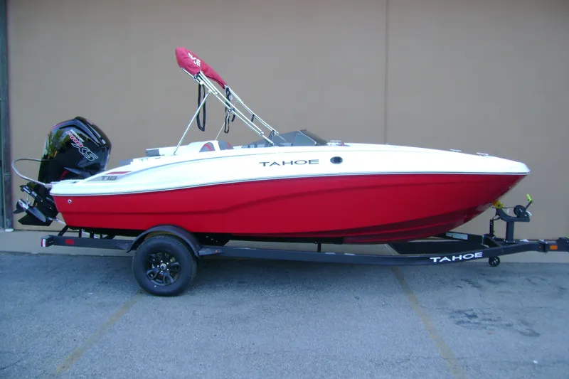 The Image of 2027 Tahoe T18 boat in red and white on a trailer, side view. - 0