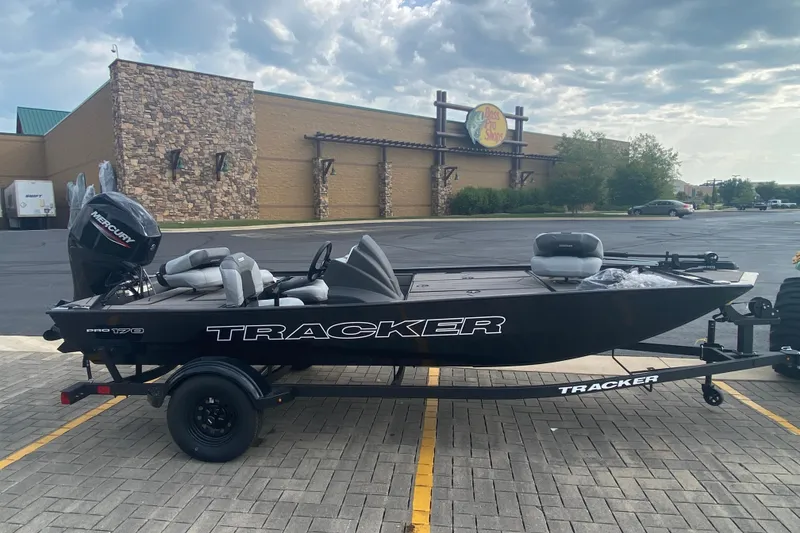 The Image of 2027 Tracker Pro 170 boat on trailer outside Bass Pro Shops. - 0