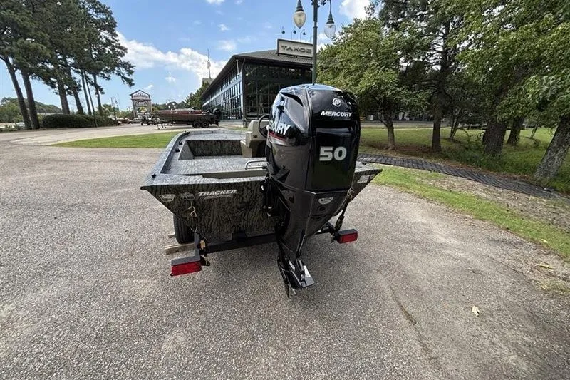 Slide: The Image of 2027 Tracker Grizzly 1648 SC boat with Mercury 50 engine, parked outdoors. - 44
