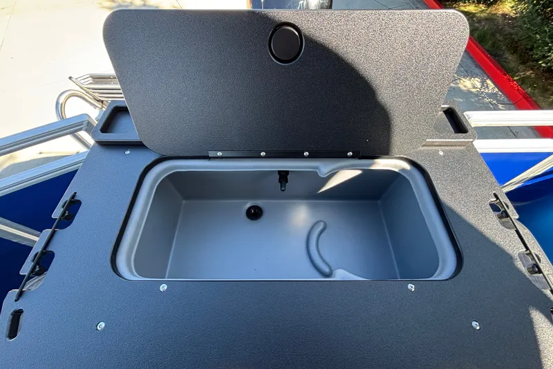 Slide: The Image of Livewell compartment on 2027 Sun Tracker SportFish 22 DLX boat, open lid view. - 32