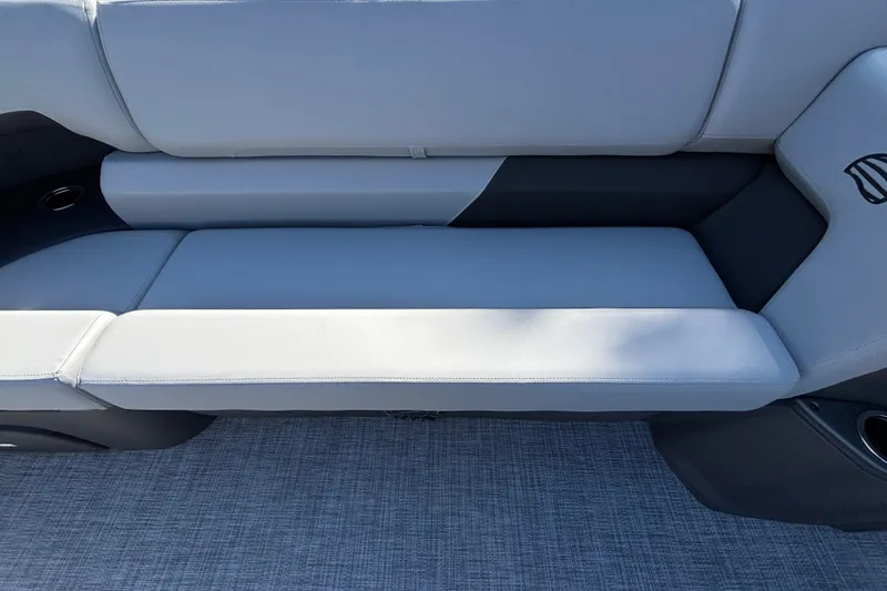 Slide: The Image of 2027 Sun Tracker SportFish 22 DLX boat seat with gray upholstery and cup holders. - 29