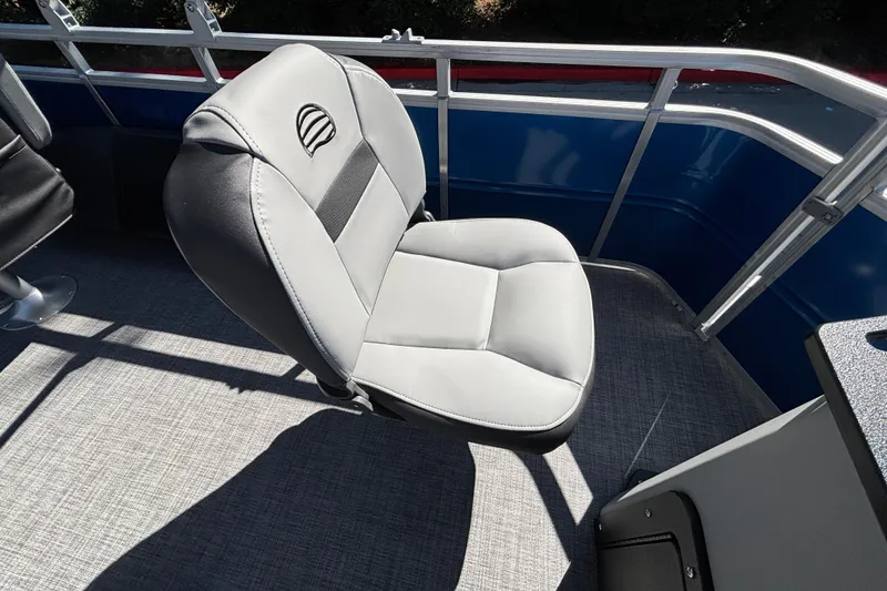 Slide: The Image of 2027 Sun Tracker SportFish 22 DLX boat seat, gray upholstery, on deck with railing. - 17