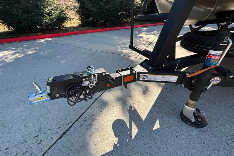 Slide: The Image of Trailer hitch of 2027 Sun Tracker SportFish 22 DLX on concrete surface. - 64