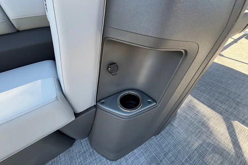 Slide: The Image of 2027 Sun Tracker SportFish 22 DLX interior with cup holder and USB port. - 24