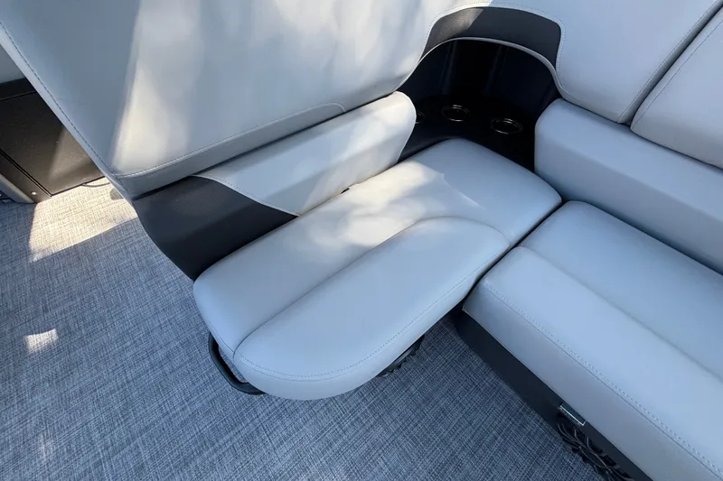 Slide: The Image of 2027 Sun Tracker SportFish 22 DLX boat interior with comfortable seating and cup holders. - 39