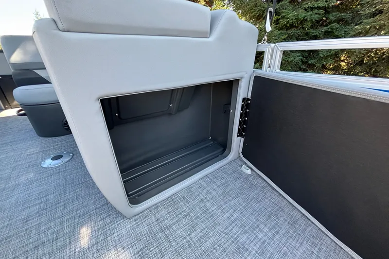 Slide: The Image of Open storage compartment on 2027 Sun Tracker SportFish 22 DLX boat. - 48