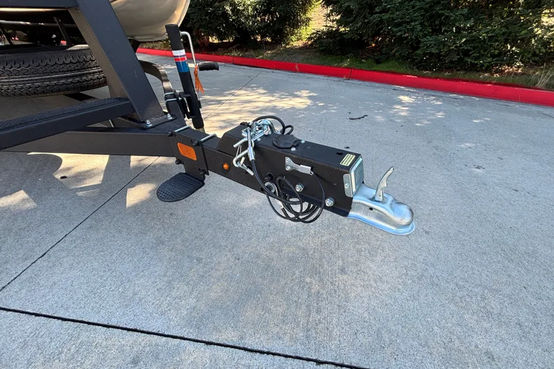 Slide: The Image of Trailer hitch of 2027 Sun Tracker SportFish 22 DLX on concrete surface. - 58