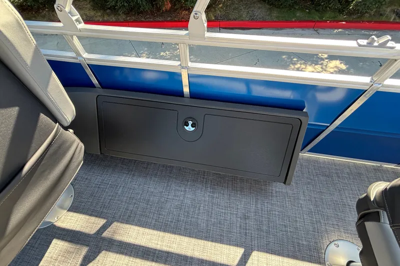 Slide: The Image of Interior view of 2027 Sun Tracker SportFish 22 DLX pontoon boat with seating and storage compartment. - 19
