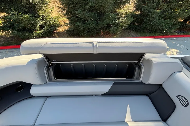 Slide: The Image of 2027 Sun Tracker SportFish 22 DLX boat seat with open storage compartment. - 25