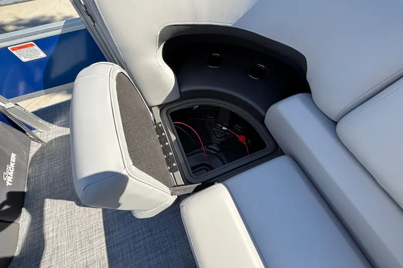 Slide: The Image of Sun Tracker SportFish 22 DLX 2027 boat seat storage compartment with cup holders and wiring. - 31