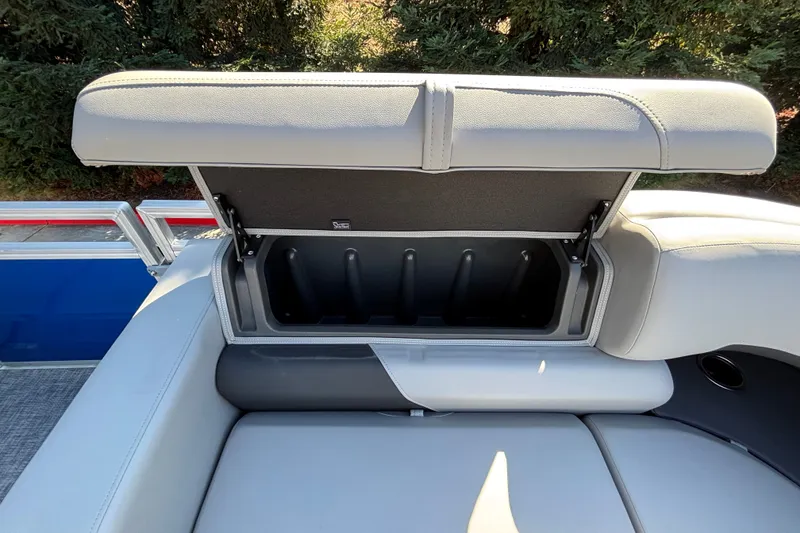 Slide: The Image of Open storage compartment on 2027 Sun Tracker SportFish 22 DLX boat seat. - 52