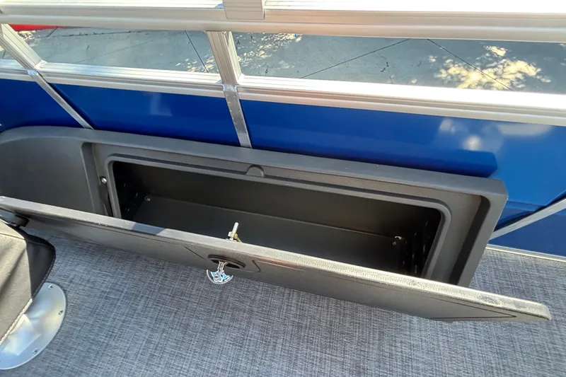 Slide: The Image of Open storage compartment on 2027 Sun Tracker SportFish 22 DLX pontoon boat. - 18