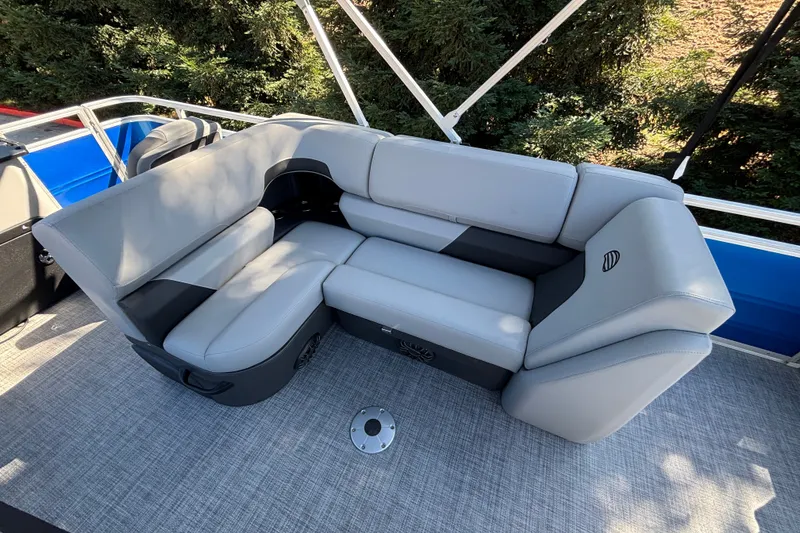 Slide: The Image of 2027 Sun Tracker SportFish 22 DLX boat interior with gray cushioned seating. - 41