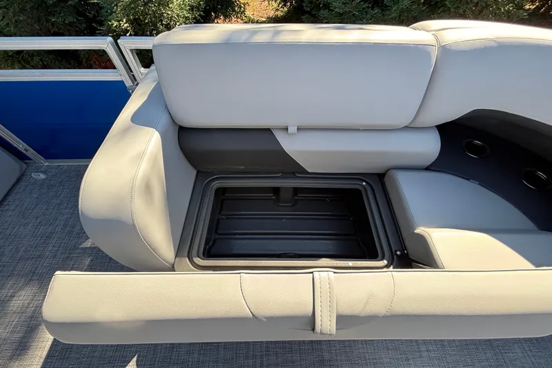 Slide: The Image of Sun Tracker SportFish 22 DLX 2027 boat seat with storage compartment open. - 50