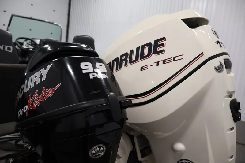 Slide: The Image of 2013 Lund 1750 Tyee boat with Mercury and Evinrude outboard motors. - 61