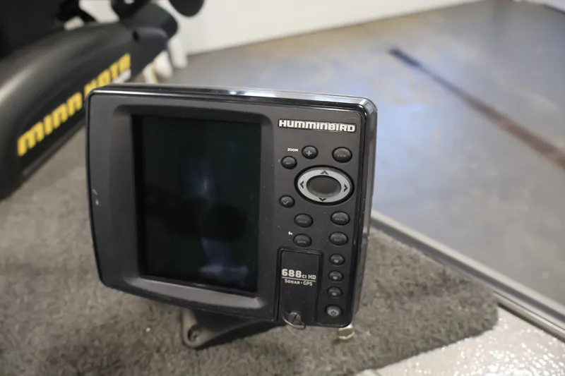 Slide: The Image of Humminbird fish finder on 2013 Lund 1750 Tyee boat, featuring sonar and GPS. - 13