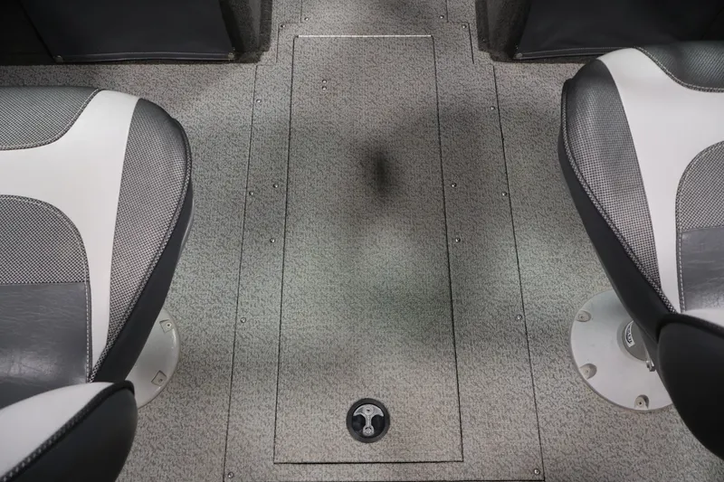 Slide: The Image of Interior of a 2013 Lund 1750 Tyee boat showing two seats and a storage compartment. - 31