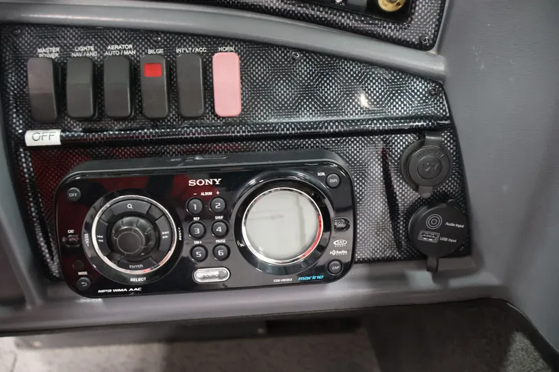 Slide: The Image of Control panel of a 2013 Lund 1750 Tyee boat with Sony marine audio system. - 59