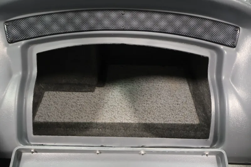 Slide: The Image of Storage compartment of a 2013 Lund 1750 Tyee boat, featuring gray interior. - 29