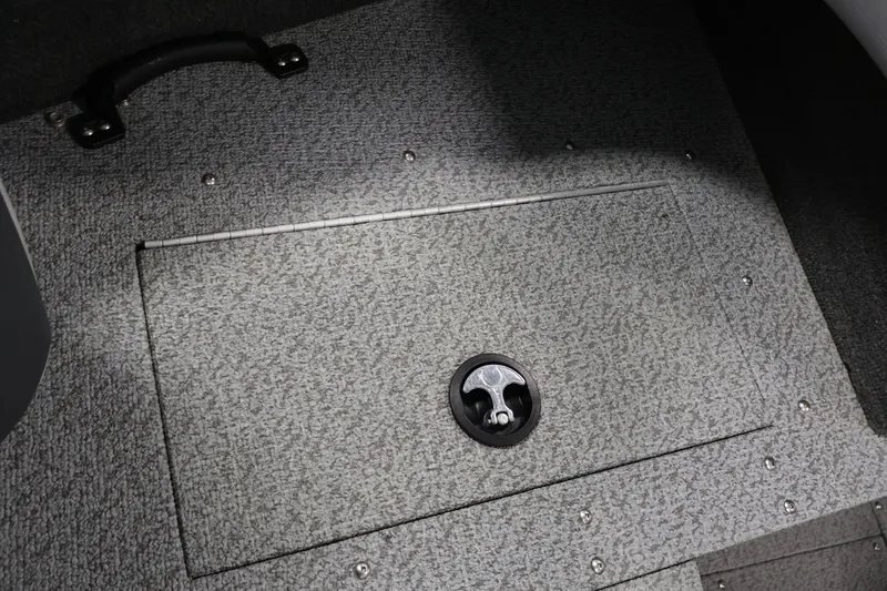 Slide: The Image of Carpeted storage compartment on 2013 Lund 1750 Tyee boat floor. - 19