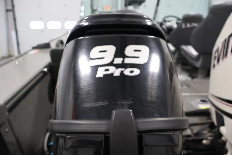 Slide: The Image of 2013 Lund 1750 Tyee boat with 9.9 Pro outboard motor in a garage. - 48