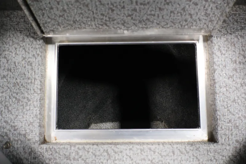 Slide: The Image of Open storage compartment in 2013 Lund 1750 Tyee boat. - 16