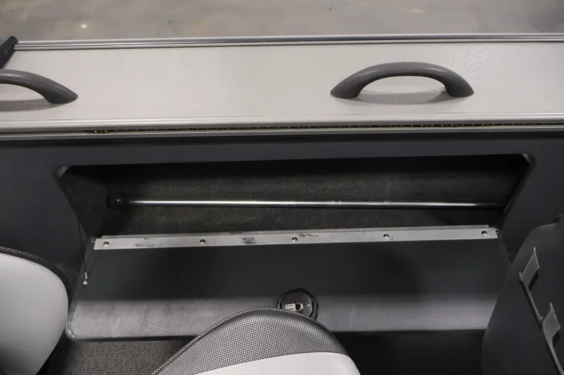 Slide: The Image of Storage compartment in a 2013 Lund 1750 Tyee boat interior. - 35