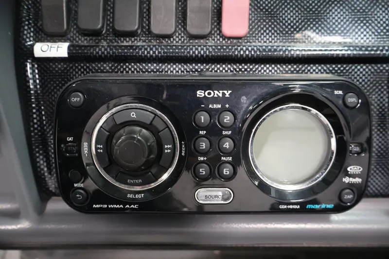 Slide: The Image of Sony marine stereo system in a 2013 Lund 1750 Tyee boat dashboard. - 24
