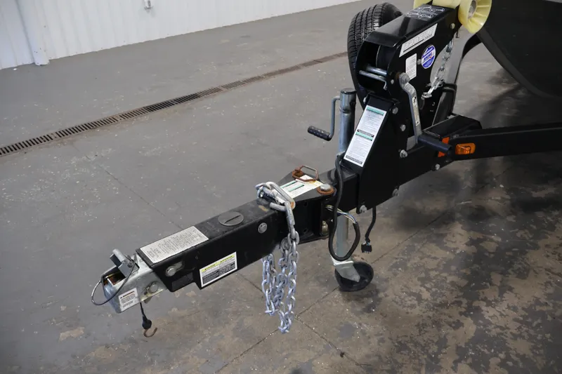 Slide: The Image of Trailer hitch of a 2013 Lund 1750 Tyee boat with safety chains attached. - 50