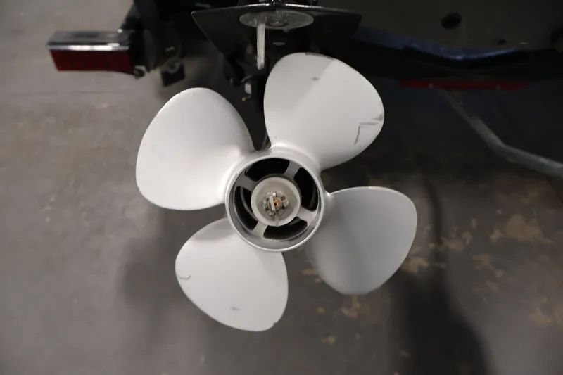 Slide: The Image of 2013 Lund 1750 Tyee boat propeller, four-blade design, close-up view. - 49
