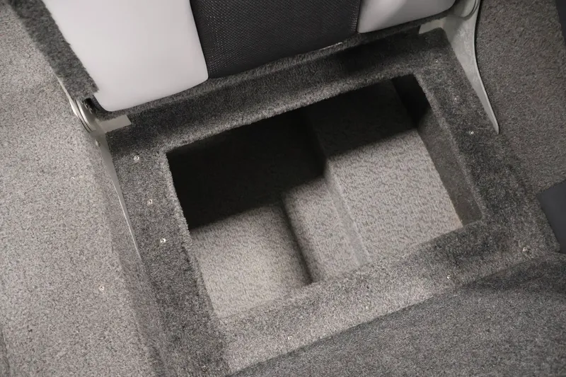 Slide: The Image of Carpeted storage compartment in a 2013 Lund 1750 Tyee boat interior. - 42
