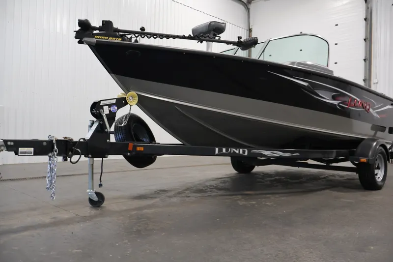 Slide: The Image of 2013 Lund 1750 Tyee boat on trailer in indoor setting. - 52