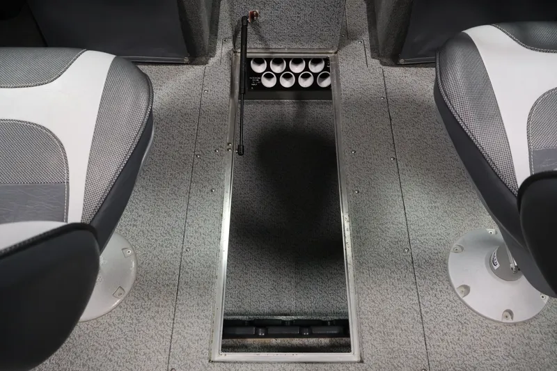 Slide: The Image of 2013 Lund 1750 Tyee boat interior with storage compartment and seating. - 32
