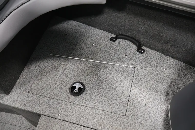 Slide: The Image of 2013 Lund 1750 Tyee boat interior with storage compartment and handle. - 17